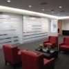 Provide intimate seating areas throughout for conversation with customers or to answer phone calls.  Behind the frosted glass are  closing rooms that provide privacy, but also allow passers by to see when it is in use.