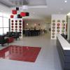 The entryway makes the first impression.  It needed to be both functional and beautiful.  A common theme throughout the showroom is the use of a red square which is a consistent design element included in each of the brands.