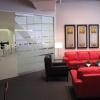 Furnish showroom with furniture in colors that reinforced branding elements.