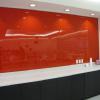 Use consistent thematic red walls to reinforce branding elements.
